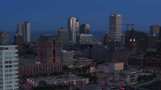 5.7K aerial stock footage a view of tall skyscrapers, reveal apartment tower, Downtown Milwaukee, Wisconsin at twilight Aerial Stock Footage | DX0002_150_039