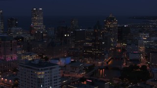 5.7K aerial stock footage a stationary view of skyscrapers at night, Downtown Milwaukee, Wisconsin Aerial Stock Footage | DX0002_151_005