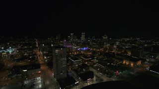 5.7K aerial stock footage a view across downtown toward city skyline at night, Downtown Milwaukee, Wisconsin Aerial Stock Footage | DX0002_151_019