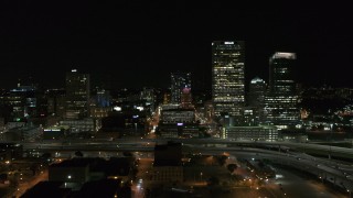 5.7K aerial stock footage of flying by downtown buildings and skyscrapers at night, Downtown Milwaukee, Wisconsin Aerial Stock Footage | DX0002_151_025