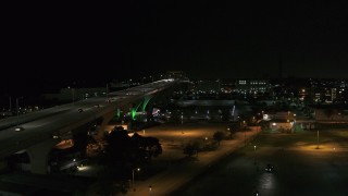 5.7K aerial stock footage fly away from light traffic on Interstate 794 at night, Downtown Milwaukee, Wisconsin Aerial Stock Footage | DX0002_151_031