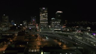 5.7K aerial stock footage of US Bank Center skyscraper by I-794 at night, Downtown Milwaukee, Wisconsin Aerial Stock Footage | DX0002_151_036