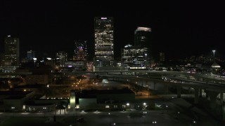 DX0002_151_037 - 5.7K aerial stock footage of US Bank Center skyscraper seen during descent at night, Downtown Milwaukee, Wisconsin