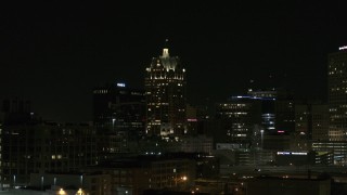 5.7K aerial stock footage of a skyscraper in Downtown Milwaukee, Wisconsin at night Aerial Stock Footage | DX0002_151_038