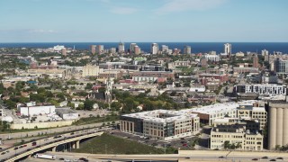 5.7K aerial stock footage of a wide view of lakeside apartment buildings across the city in Milwaukee, Wisconsin Aerial Stock Footage | DX0002_152_026