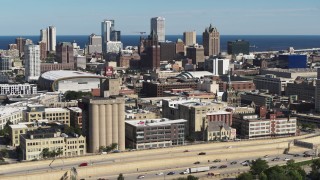 DX0002_152_028 - 5.7K aerial stock footage the city's skyline seen from the freeway in Downtown Milwaukee, Wisconsin