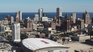 5.7K aerial stock footage reverse view of the city's skyline and arena in Downtown Milwaukee, Wisconsin Aerial Stock Footage | DX0002_152_035