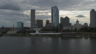 DX0002_154_017 - 5.7K aerial stock footage stationary view of city's waterfront museum and skyline from Lake Michigan in Downtown Milwaukee, Wisconsin