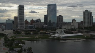 5.7K aerial stock footage of passing by tall skyscrapers and a museum, Downtown Milwaukee, Wisconsin Aerial Stock Footage | DX0002_154_022