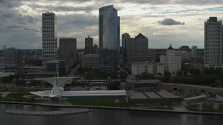 5.7K aerial stock footage of tall skyscrapers seen while passing the museum, Downtown Milwaukee, Wisconsin Aerial Stock Footage | DX0002_154_024