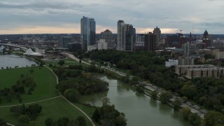 5.7K aerial stock footage of a reverse view of the skyline from Veterans Park, Downtown Milwaukee, Wisconsin Aerial Stock Footage | DX0002_154_030