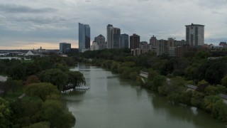 5.7K aerial stock footage of the city's skyline, seen from pond at Veterans Park, Downtown Milwaukee, Wisconsin Aerial Stock Footage | DX0002_154_036