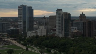 5.7K aerial stock footage flying away from the city's skyline at sunset, Downtown Milwaukee, Wisconsin Aerial Stock Footage | DX0002_155_008