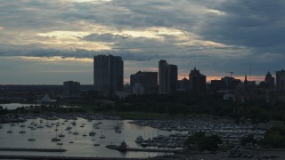 5.7K aerial stock footage the city's skyline seen while ascending near marina at sunset, Downtown Milwaukee, Wisconsin Aerial Stock Footage | DX0002_155_016