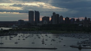 5.7K aerial stock footage the city's skyline seen while passing by marina at sunset, Downtown Milwaukee, Wisconsin Aerial Stock Footage | DX0002_155_018