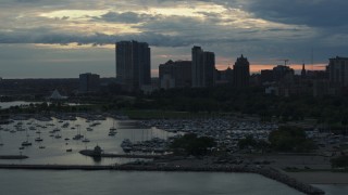 5.7K aerial stock footage the city's skyline seen from the marina at sunset, Downtown Milwaukee, Wisconsin Aerial Stock Footage | DX0002_155_019