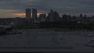 5.7K aerial stock footage of flying past the marina with a view of the city's skyline at twilight, Downtown Milwaukee, Wisconsin Aerial Stock Footage | DX0002_155_030