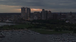 5.7K aerial stock footage a stationary view of the city's skyline at twilight from over the marina, Downtown Milwaukee, Wisconsin Aerial Stock Footage | DX0002_155_032