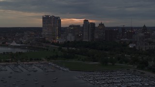 5.7K aerial stock footage flyby and away from the city's skyline at twilight, Downtown Milwaukee, Wisconsin Aerial Stock Footage | DX0002_155_033