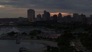 5.7K aerial stock footage descend near marina and the city's skyline at twilight, Downtown Milwaukee, Wisconsin Aerial Stock Footage | DX0002_155_037