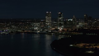 5.7K aerial stock footage of a view of the city's skyline while flying near the marina at night, Downtown Milwaukee, Wisconsin Aerial Stock Footage | DX0002_155_040