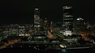 DX0002_157_005 - 5.7K aerial stock footage flyby towering skyscrapers at night, Downtown Milwaukee, Wisconsin