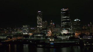 DX0002_157_008 - 5.7K aerial stock footage approach and flyby towering skyscrapers at night, Downtown Milwaukee, Wisconsin