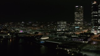 5.7K aerial stock footage fly away from museum and skyscrapers at night, Downtown Milwaukee, Wisconsin Aerial Stock Footage | DX0002_157_012