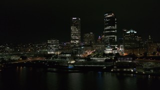 DX0002_157_013 - 5.7K aerial stock footage orbiting museum and skyscrapers at night, Downtown Milwaukee, Wisconsin