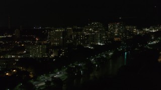 5.7K aerial stock footage of passing a row of apartment buildings at night, Milwaukee, Wisconsin Aerial Stock Footage | DX0002_157_030