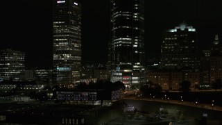 5.7K aerial stock footage orbit base of a towering skyscraper at night, Downtown Milwaukee, Wisconsin Aerial Stock Footage | DX0002_157_035