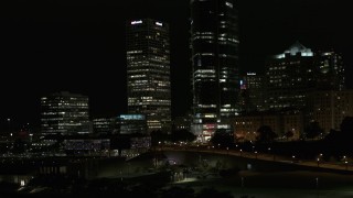 5.7K aerial stock footage orbiting the base of a towering skyscraper at night, Downtown Milwaukee, Wisconsin Aerial Stock Footage | DX0002_157_036