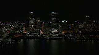 5.7K aerial stock footage view of towering skyscrapers seen from the lake at night, Downtown Milwaukee, Wisconsin Aerial Stock Footage | DX0002_157_041