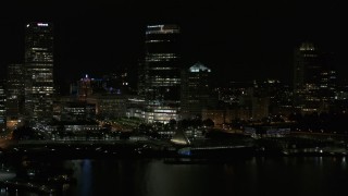 5.7K aerial stock footage approach skyscraper and museum from Lake Michigan at night, Downtown Milwaukee, Wisconsin Aerial Stock Footage | DX0002_157_043