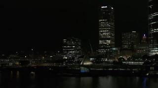 DX0002_157_046 - 5.7K aerial stock footage circle the lakefront museum near skyscrapers at night, Downtown Milwaukee, Wisconsin