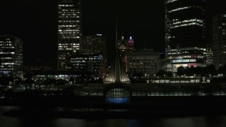 5.7K aerial stock footage approach and fly over the lakefront museum near skyscrapers at night, Downtown Milwaukee, Wisconsin Aerial Stock Footage | DX0002_157_049