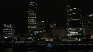 5.7K aerial stock footage descend past museum near skyscrapers at night, Downtown Milwaukee, Wisconsin Aerial Stock Footage | DX0002_157_052