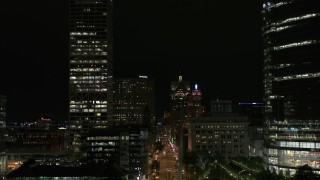 5.7K aerial stock footage fly over museum near skyscrapers, reveal city street at night, Downtown Milwaukee, Wisconsin Aerial Stock Footage | DX0002_157_053