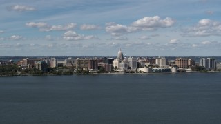 DX0002_158_007 - 5.7K aerial stock footage a reverse view of lakefront city buildings in Madison, Wisconsin