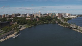 5.7K aerial stock footage descend toward lake with view of of apartment buildings near the capitol dome in Madison, Wisconsin Aerial Stock Footage | DX0002_158_014