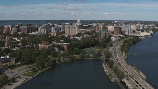 5.7K aerial stock footage flyby and fly away from apartment complexes around the capitol dome in Madison, Wisconsin Aerial Stock Footage | DX0002_158_019