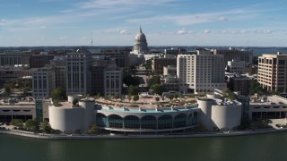 5.7K aerial stock footage of the capitol dome and office buildings, seen while ascending past convention center, Madison, Wisconsin Aerial Stock Footage | DX0002_158_036