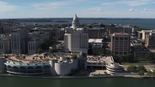 5.7K aerial stock footage of the capitol dome and office buildings, seen while from the convention center, Madison, Wisconsin Aerial Stock Footage | DX0002_158_037