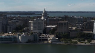 5.7K aerial stock footage of the capitol seen from lakefront office buildings, Madison, Wisconsin Aerial Stock Footage | DX0002_160_004