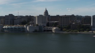 5.7K aerial stock footage dome of the capitol seen while flying away from office buildings and convention center, Madison, Wisconsin Aerial Stock Footage | DX0002_160_006