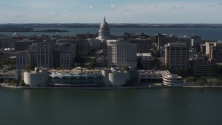 5.7K aerial stock footage of passing the convention center with capitol and office buildings in background, Madison, Wisconsin Aerial Stock Footage | DX0002_160_010