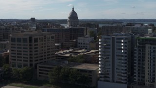 5.7K aerial stock footage focus on capitol and pass by office buildings, Madison, Wisconsin Aerial Stock Footage | DX0002_160_015