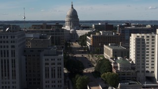 5.7K aerial stock footage focus on the capitol building while passing office buildings, Madison, Wisconsin Aerial Stock Footage | DX0002_160_016