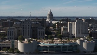 5.7K aerial stock footage pass by office buildings and focus on the capitol building in Madison, Wisconsin Aerial Stock Footage | DX0002_160_017