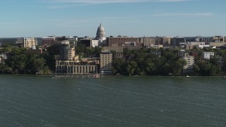 5.7K aerial stock footage focus on the capitol dome while flying past a lakeside hotel in Madison, Wisconsin Aerial Stock Footage | DX0002_160_027